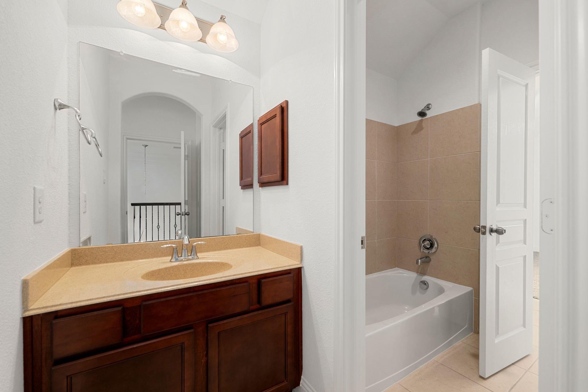 22719 Shieldhall Lane Tomball, TX 77375 - Photo 32 of 49 a bathroom with a tub sink and mirror