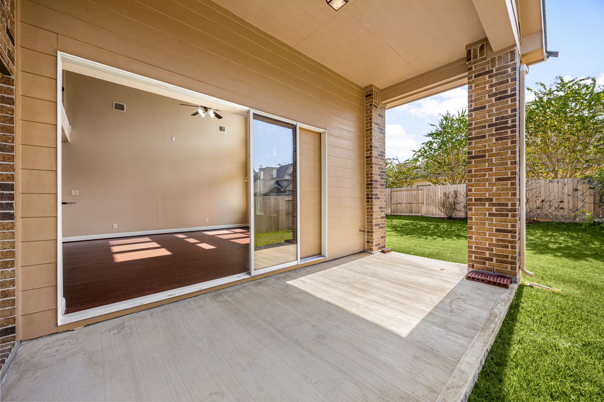 22719 Shieldhall Lane Tomball, TX 77375 - Photo 43 of 49 a view of a room with wooden floor and a porch