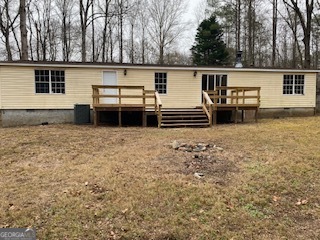 1368 Dee Kennedy Road Auburn, GA 30011 - Photo 14 of 15 a view of a house with a back yard