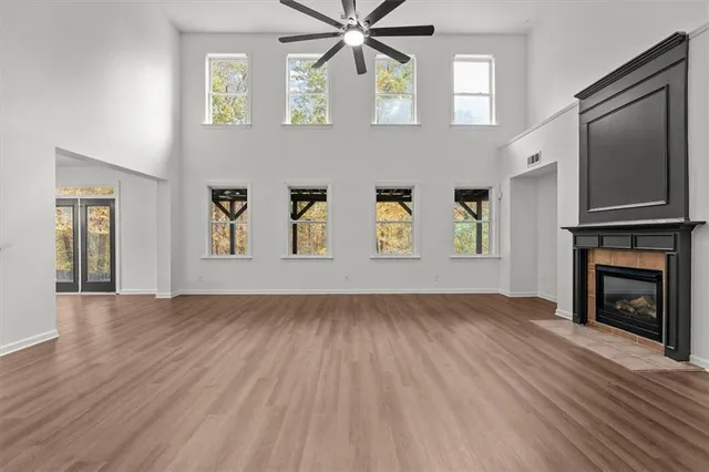 a living room with furniture a window and a fireplace