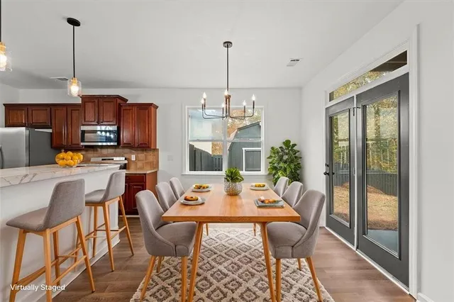 a kitchen with stainless steel appliances a sink stove and refrigerator