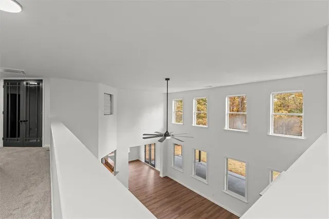 a bathroom with a granite countertop sink a toilet and bathtub