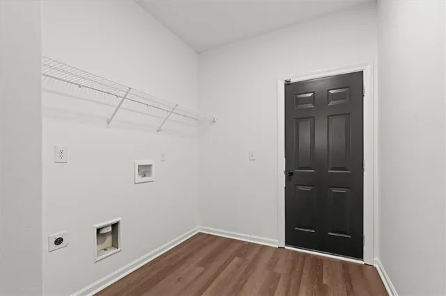 an aerial view of a houses with city view