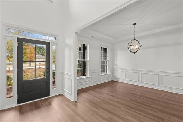 a view of a dining room with furniture window and wooden floor