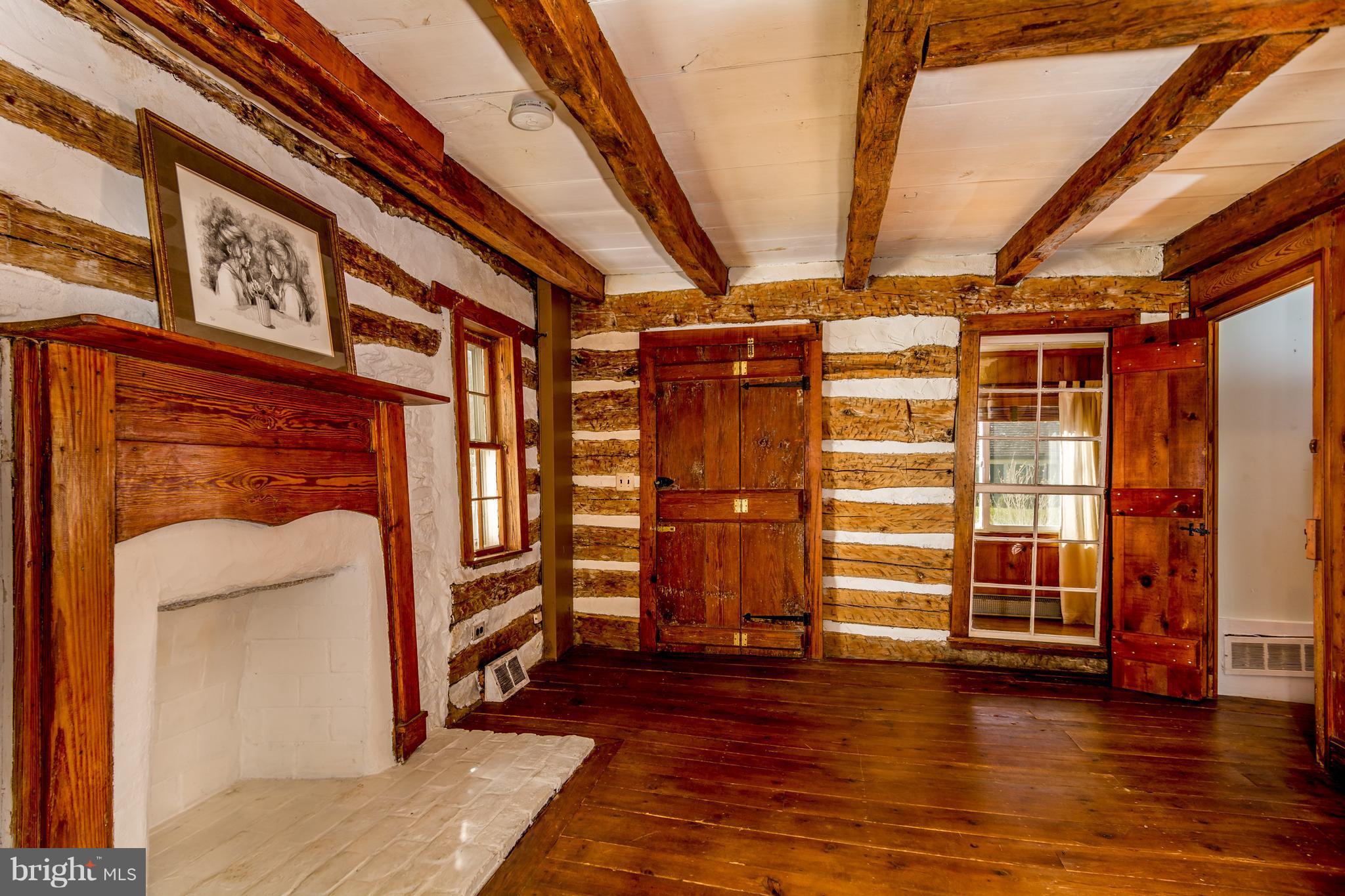 2806 Crenshaw Road Marshall, VA 20115 - Photo 12 of 30 a view of an empty room with wooden floor and furniture