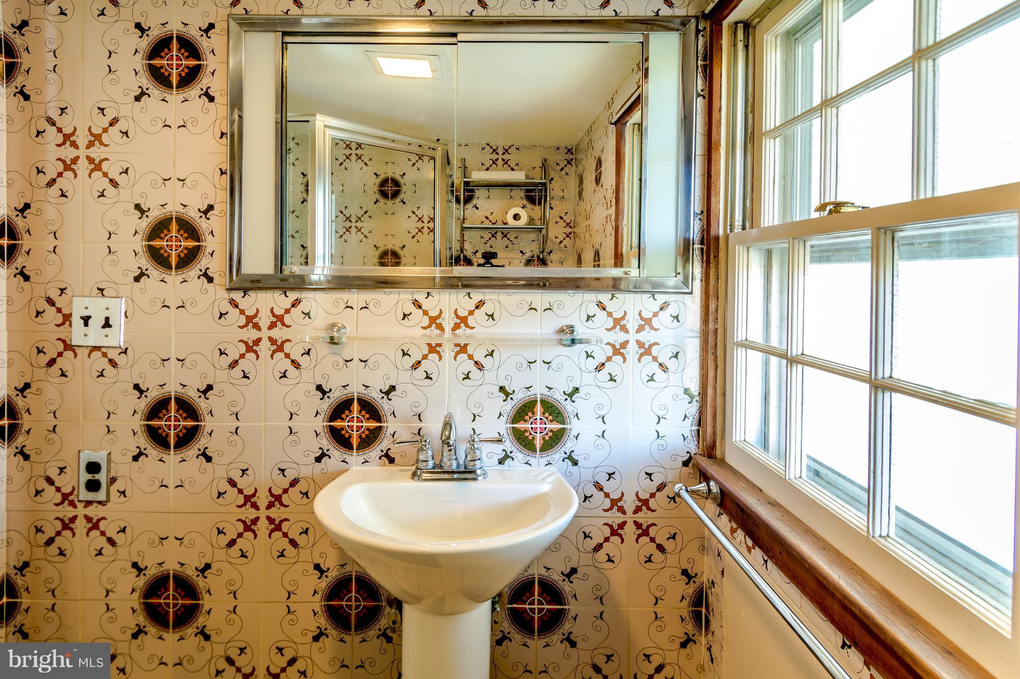 2806 Crenshaw Road Marshall, VA 20115 - Photo 13 of 30 a bathroom with a sink and mirror with toilet