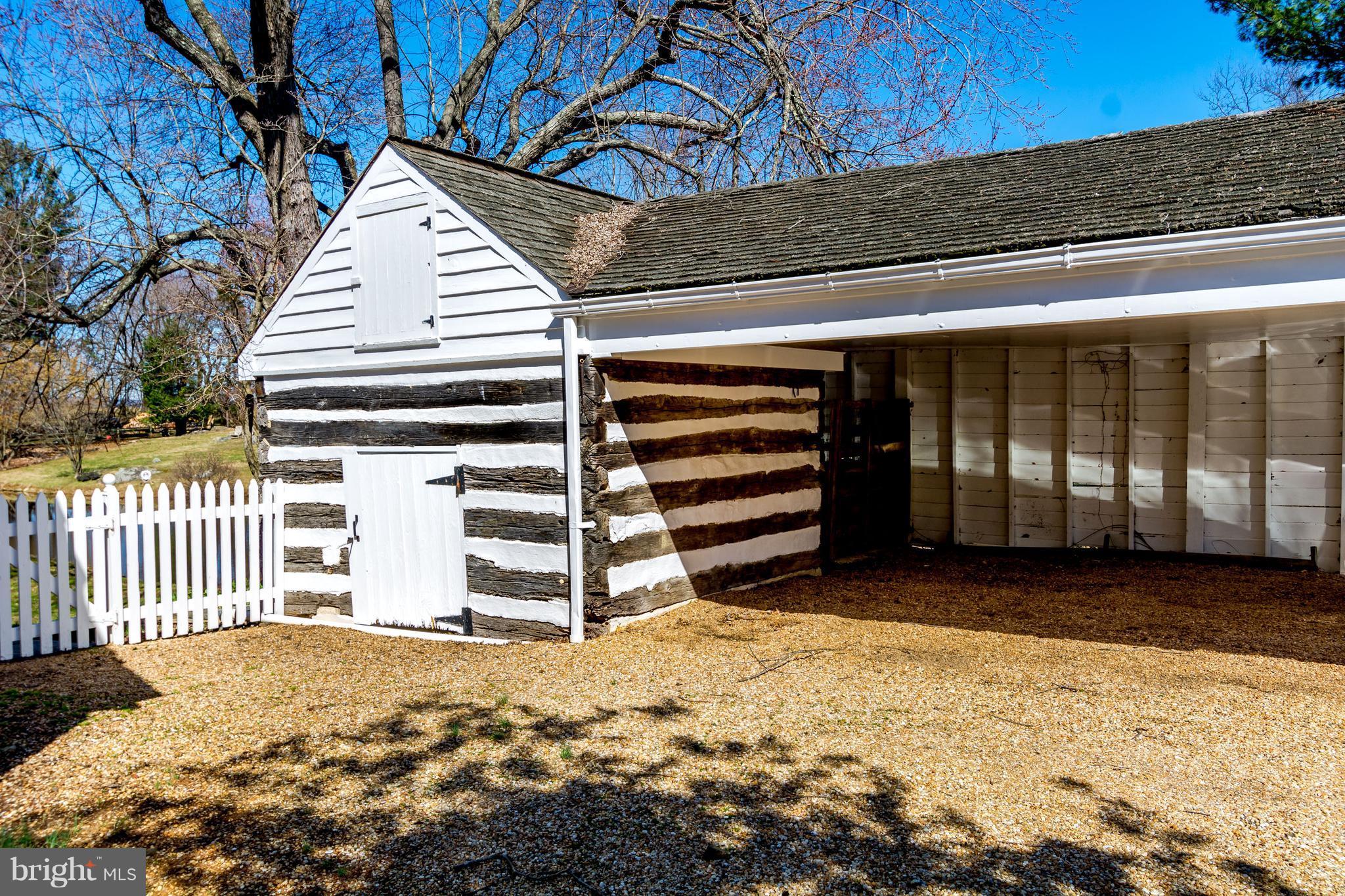 2806 Crenshaw Road Marshall, VA 20115 - Photo 23 of 30 a view of a house with a yard and wooden fence