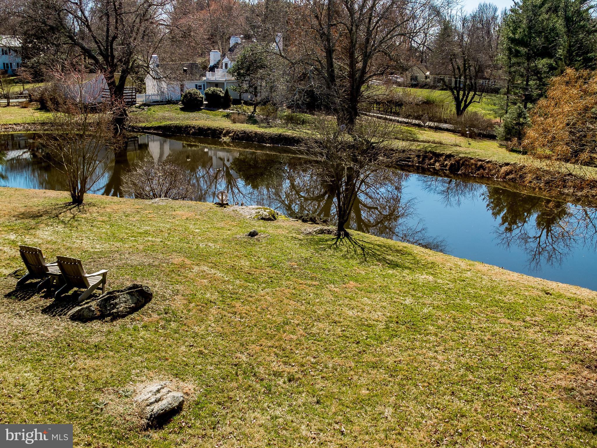 2806 Crenshaw Road Marshall, VA 20115 - Photo 26 of 30 a backyard of a house with lots of green space and lake view