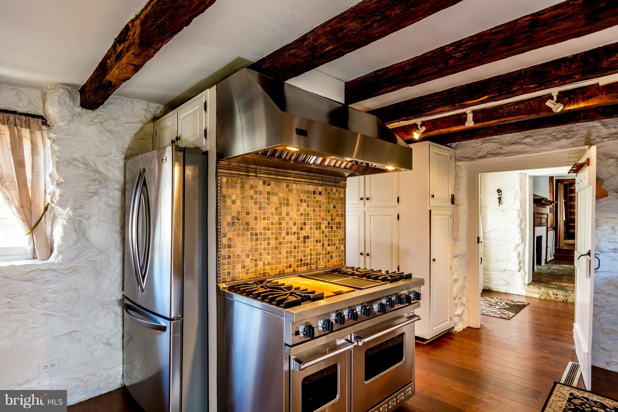 2806 Crenshaw Road Marshall, VA 20115 - Photo 4 of 30 a kitchen with stainless steel appliances granite countertop a stove and a refrigerator