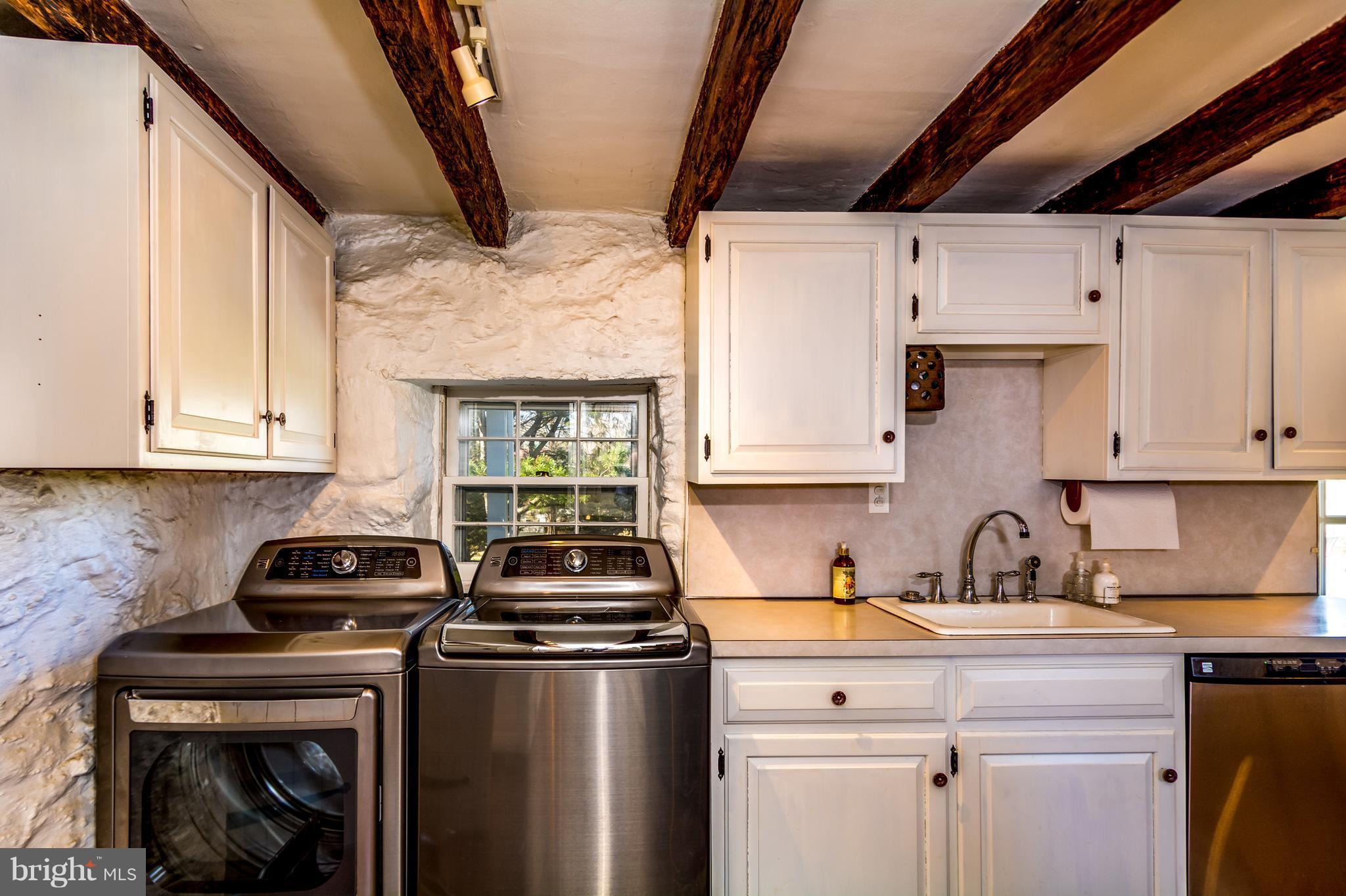 2806 Crenshaw Road Marshall, VA 20115 - Photo 5 of 30 a kitchen with stainless steel appliances a sink a stove and white cabinets