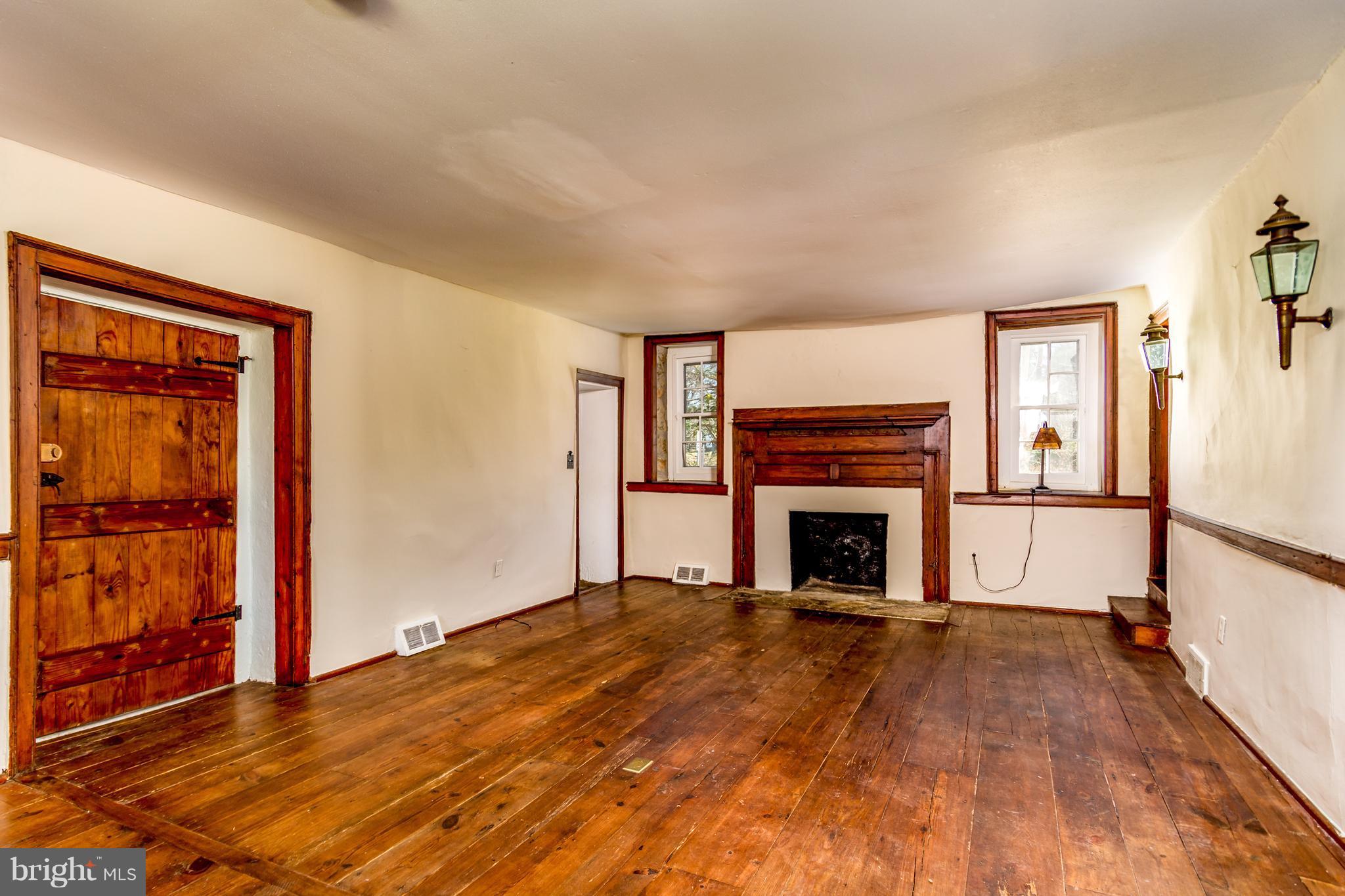 2806 Crenshaw Road Marshall, VA 20115 - Photo 8 of 30 a living room with a fireplace with wooden floor