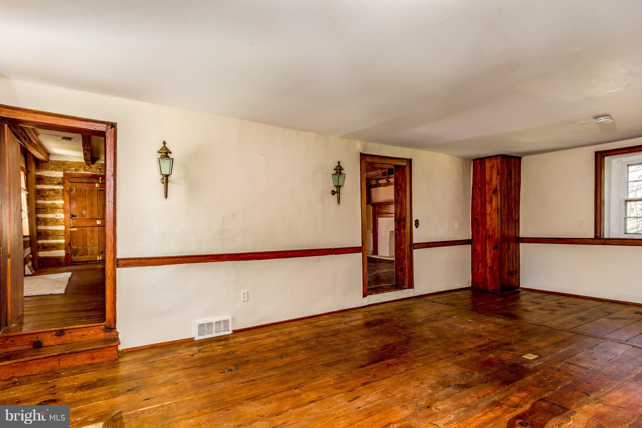 2806 Crenshaw Road Marshall, VA 20115 - Photo 9 of 30 an empty room with wooden floor and windows