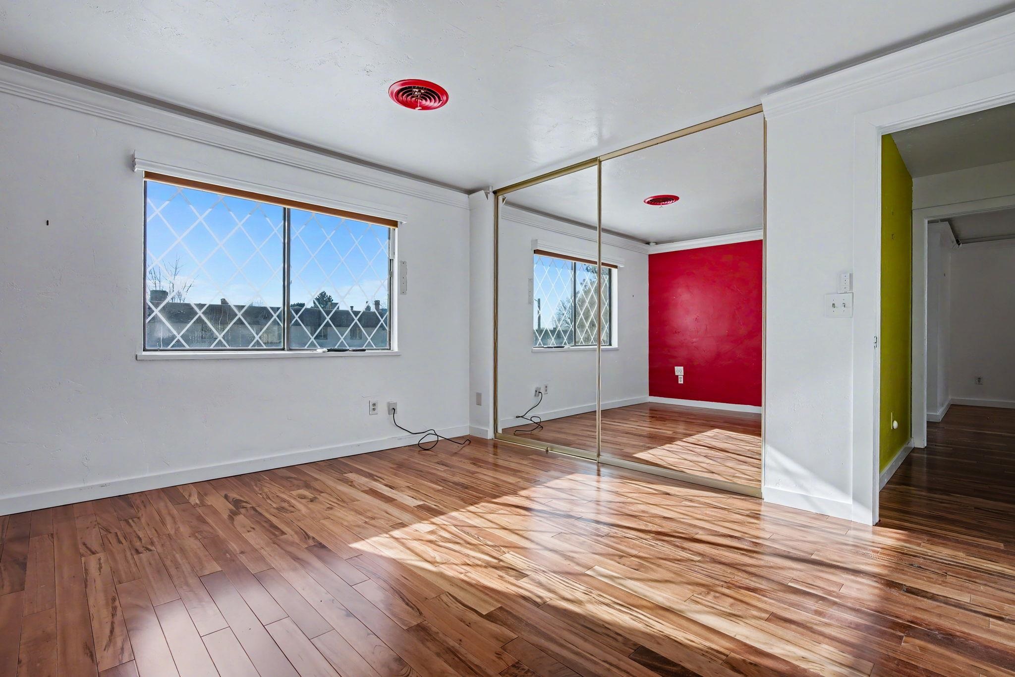 2700 G Road, Unit 12F Grand Junction, CO 81506 - Photo 18 of 24 a view of an empty room with wooden floor and a window