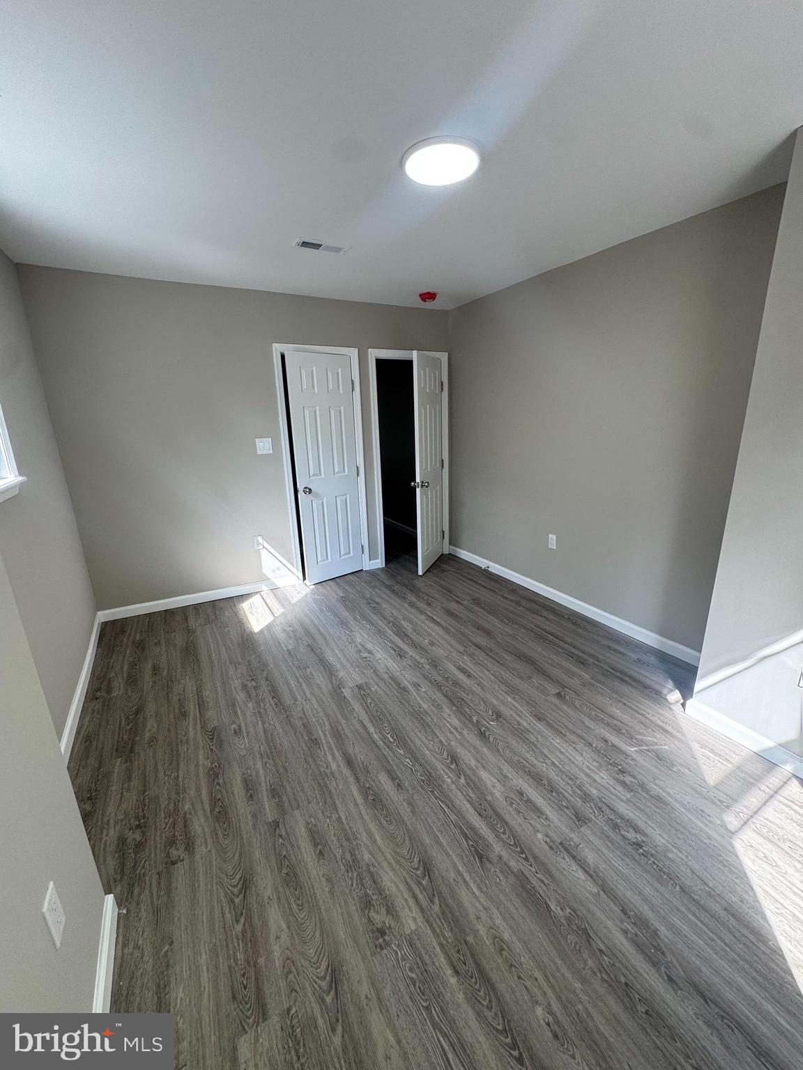 6018 Ross Street Philadelphia, PA 19144 - Photo 5 of 14 a view of an empty room with wooden floor