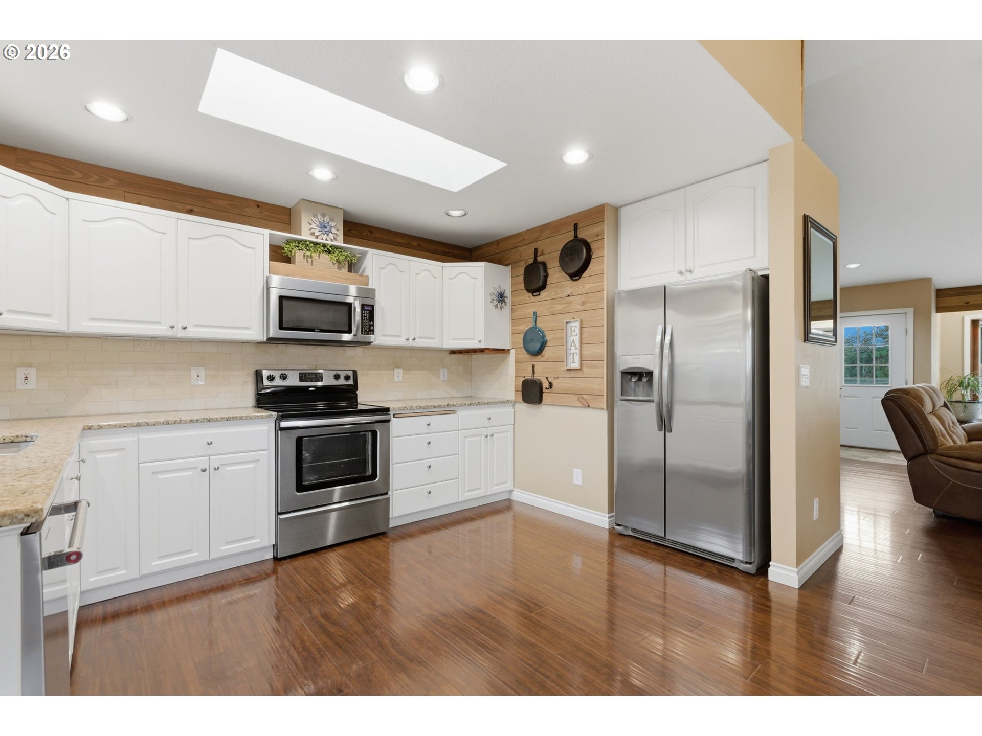 1315 High Street Gladstone, OR 97027 - Photo 15 of 36 a kitchen with kitchen island a refrigerator and a sink