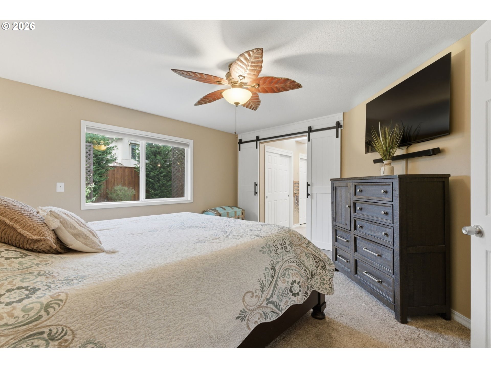 1315 High Street Gladstone, OR 97027 - Photo 18 of 36 a bedroom with a large bed and flat tv