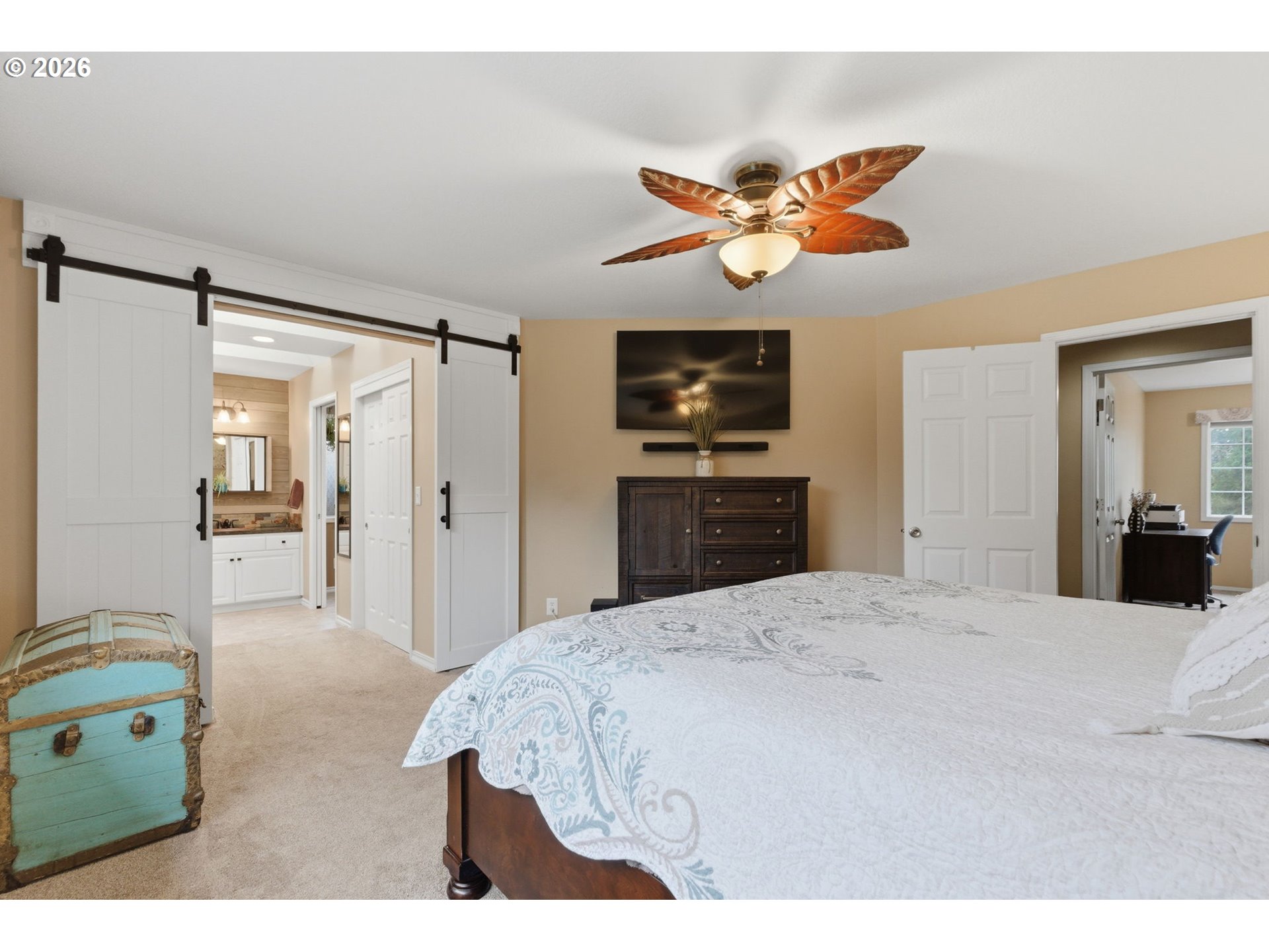 1315 High Street Gladstone, OR 97027 - Photo 19 of 36 a bedroom with a bed and a chandelier