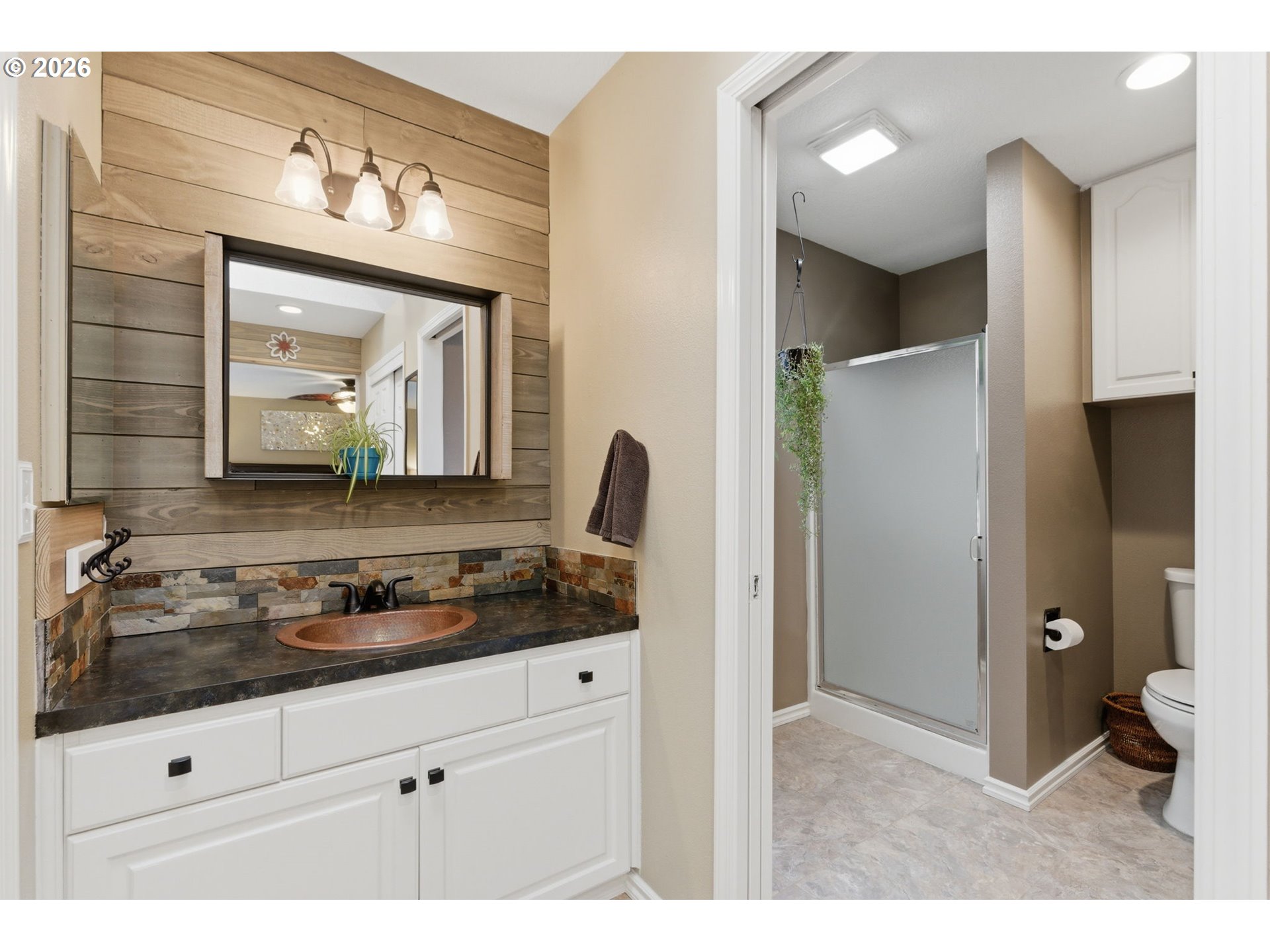 1315 High Street Gladstone, OR 97027 - Photo 21 of 36 a bathroom with a sink and a mirror