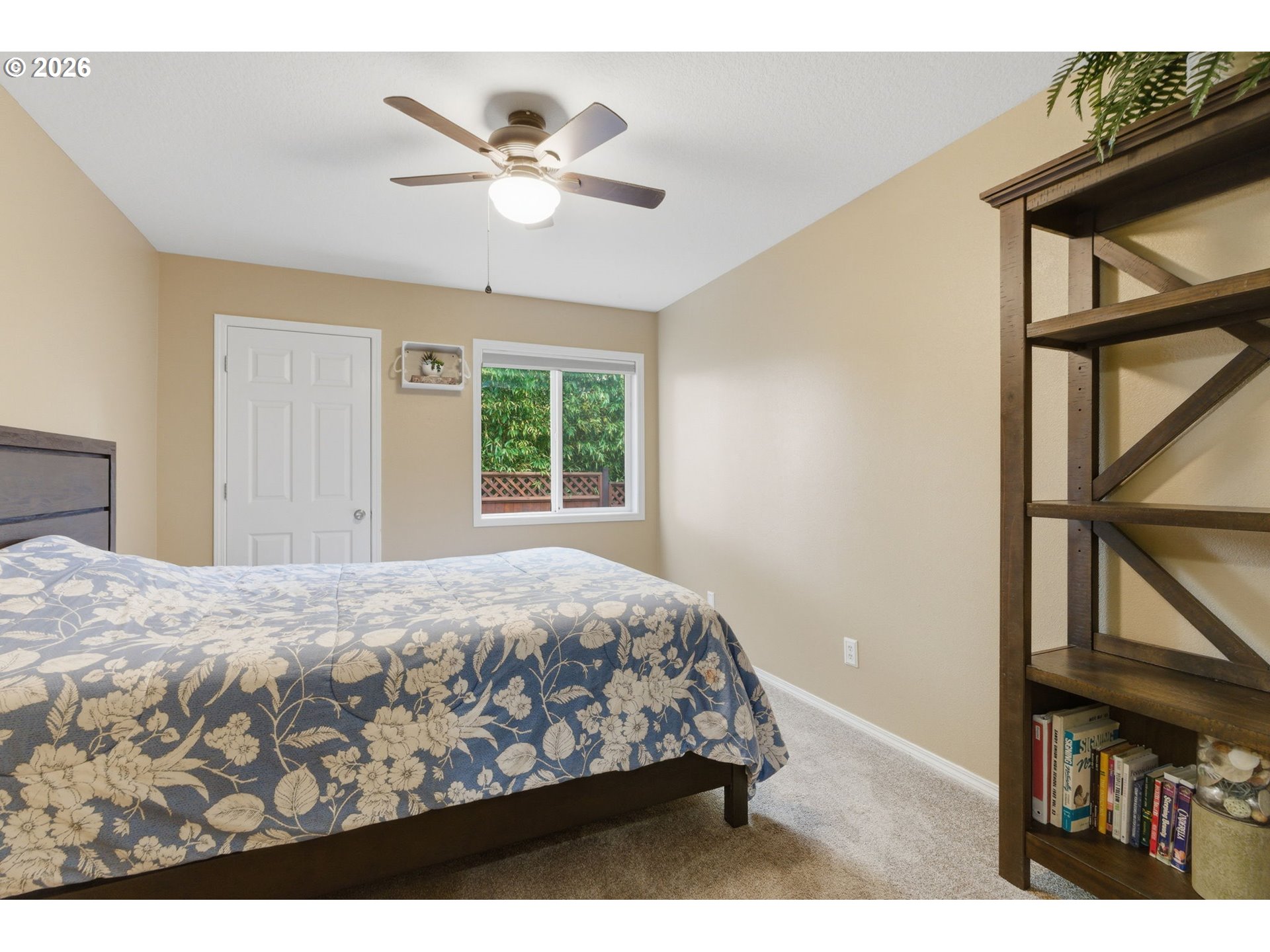 1315 High Street Gladstone, OR 97027 - Photo 22 of 36 a bedroom with a bed window and a chandelier
