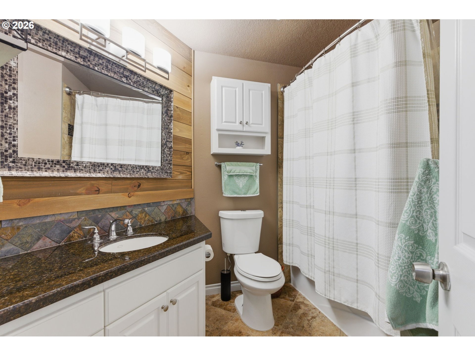 1315 High Street Gladstone, OR 97027 - Photo 24 of 36 a bathroom with a granite countertop sink mirror vanity and toilet