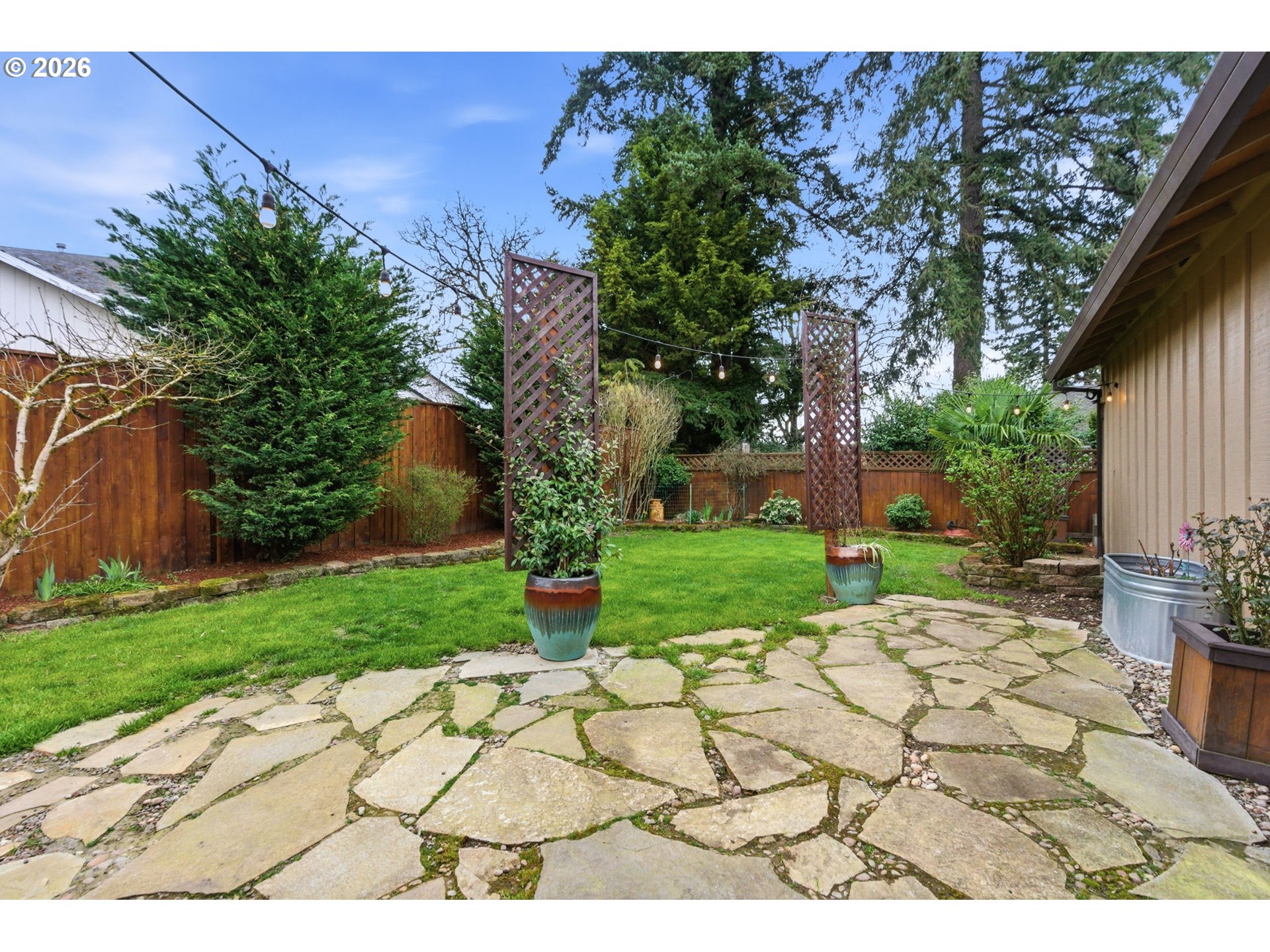 1315 High Street Gladstone, OR 97027 - Photo 28 of 36 a view of a yard with plants and trees