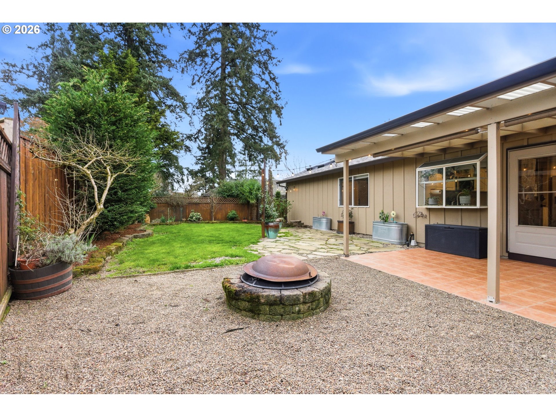 1315 High Street Gladstone, OR 97027 - Photo 30 of 36 a front view of a house with a yard and garage