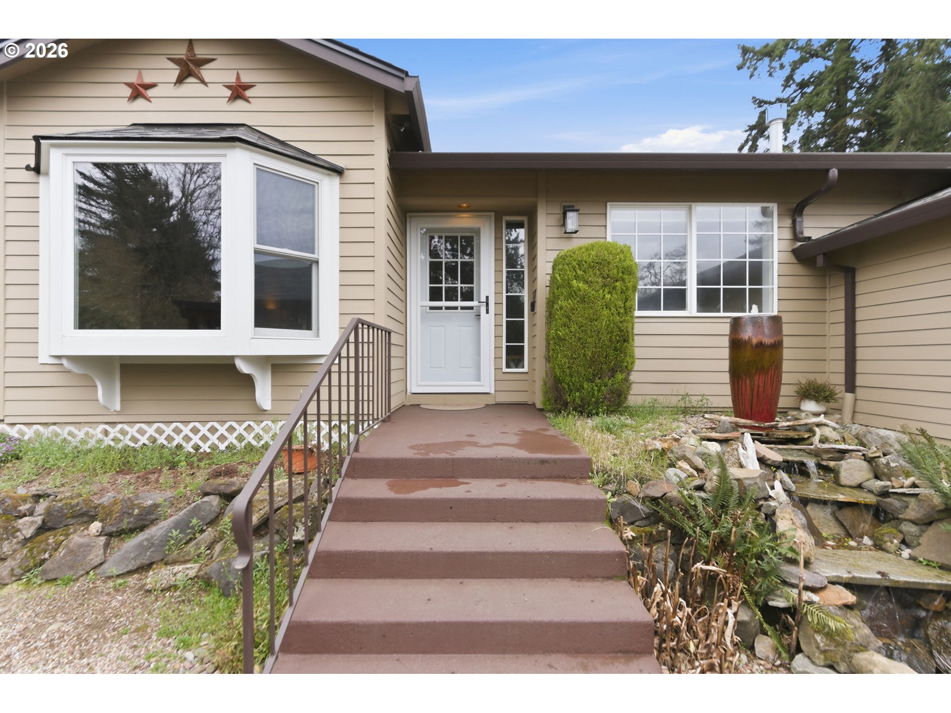 1315 High Street Gladstone, OR 97027 - Photo 5 of 36 a front view of a house with a garden
