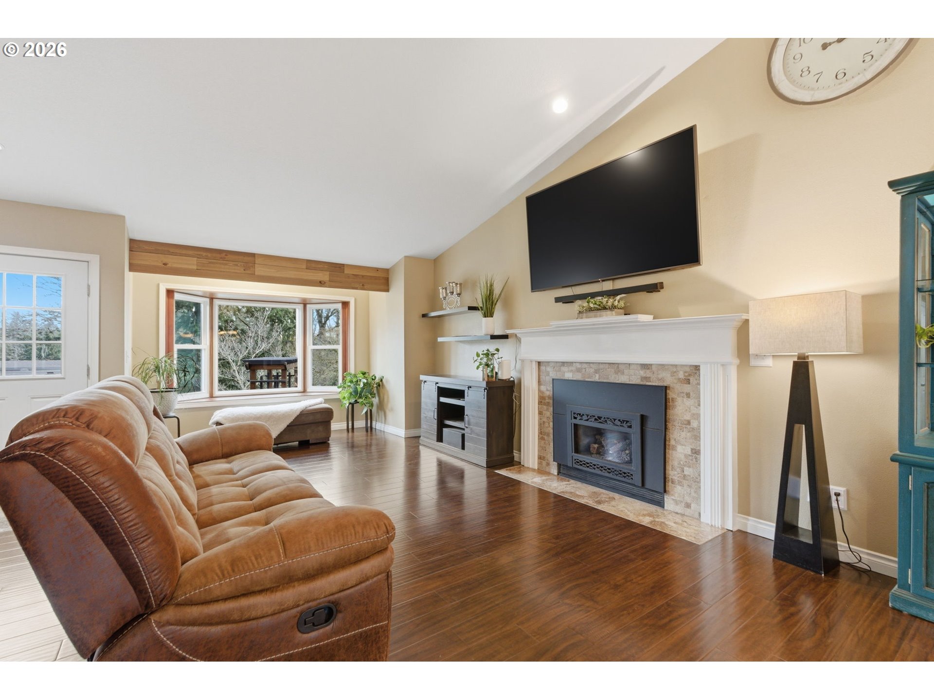 1315 High Street Gladstone, OR 97027 - Photo 10 of 36 a living room with furniture a flat screen tv and a fireplace