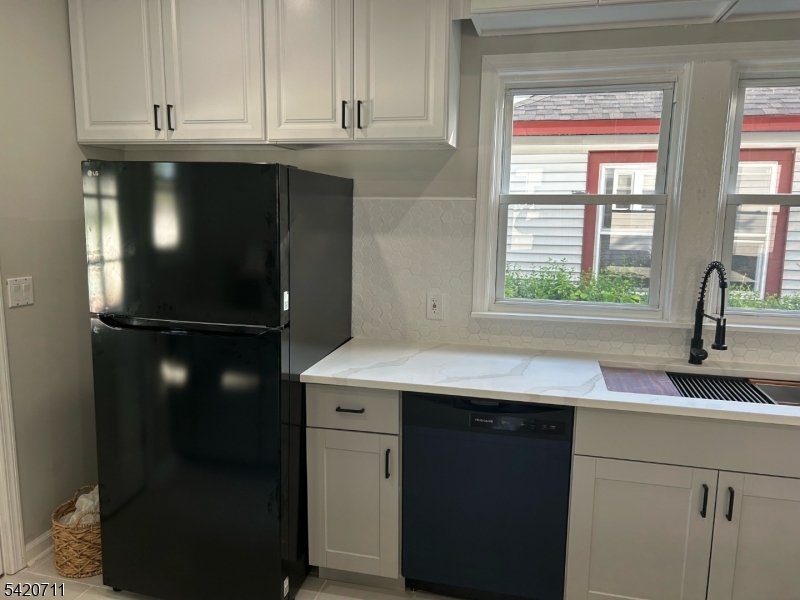 1324 George Street Plainfield, NJ 07062 - Photo 4 of 26 a kitchen with a sink and a refrigerator