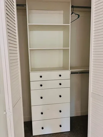 a close view of closet with wooden floor