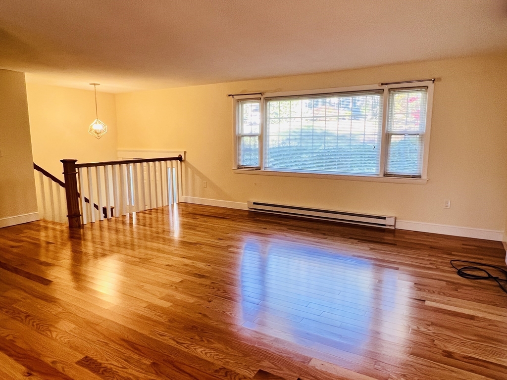 135 Walker Pond Road Sturbridge, MA 01566 - Photo 2 of 16 a view of a room with wooden floor and a window