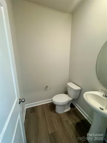 a bathroom with a toilet and a sink