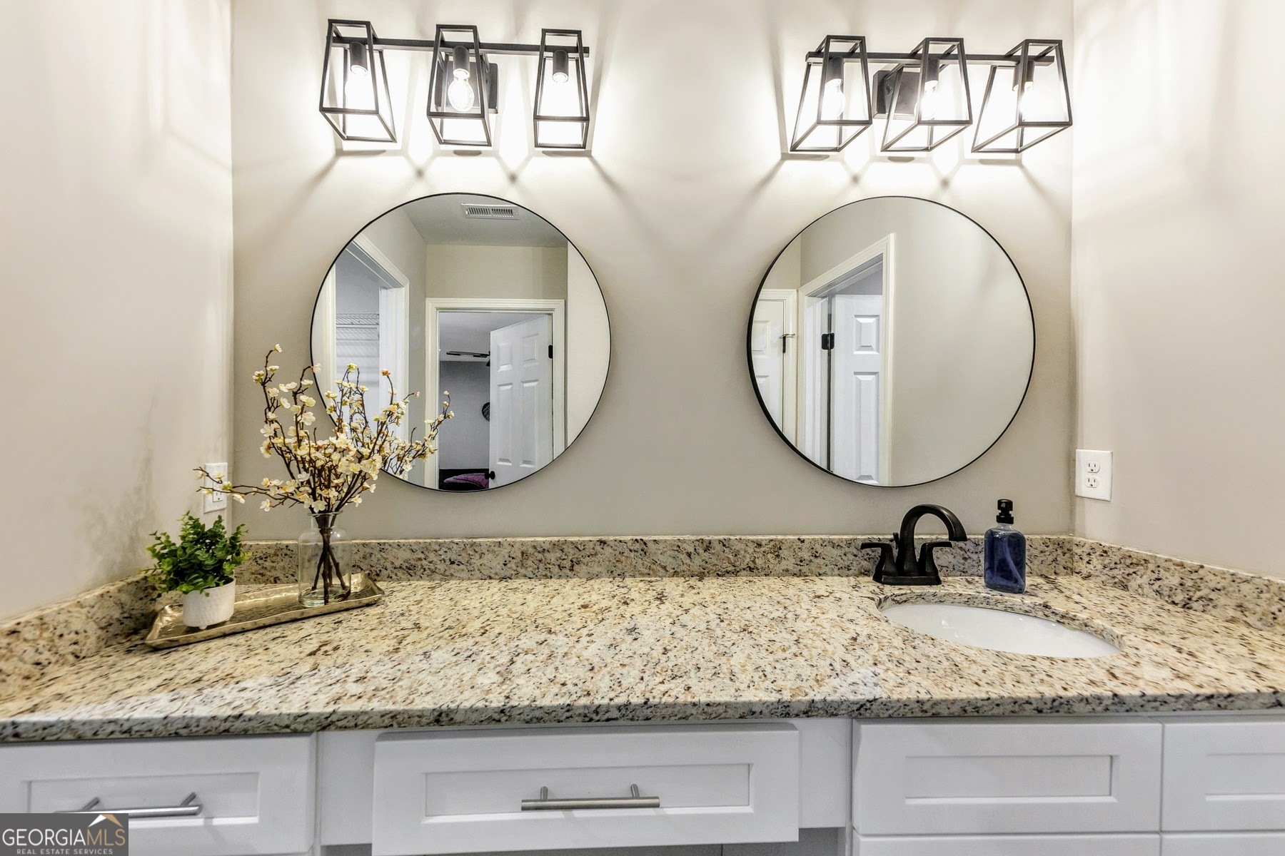 1018 Falling Valley Court Southeast Smyrna, GA 30080 - Photo 14 of 25 a bathroom with a sink and a mirror