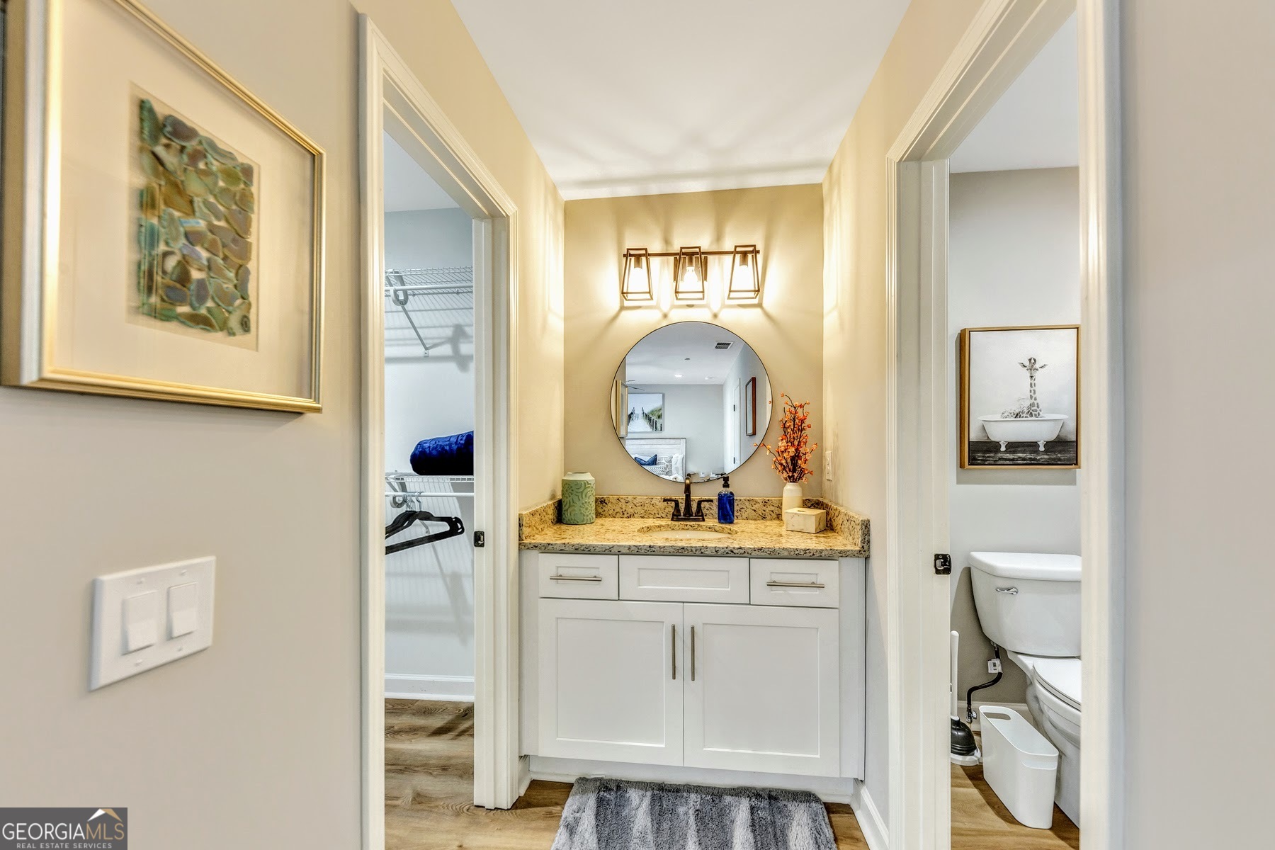 1018 Falling Valley Court Southeast Smyrna, GA 30080 - Photo 20 of 25 a en suite bathroom with a toilet sink and mirror