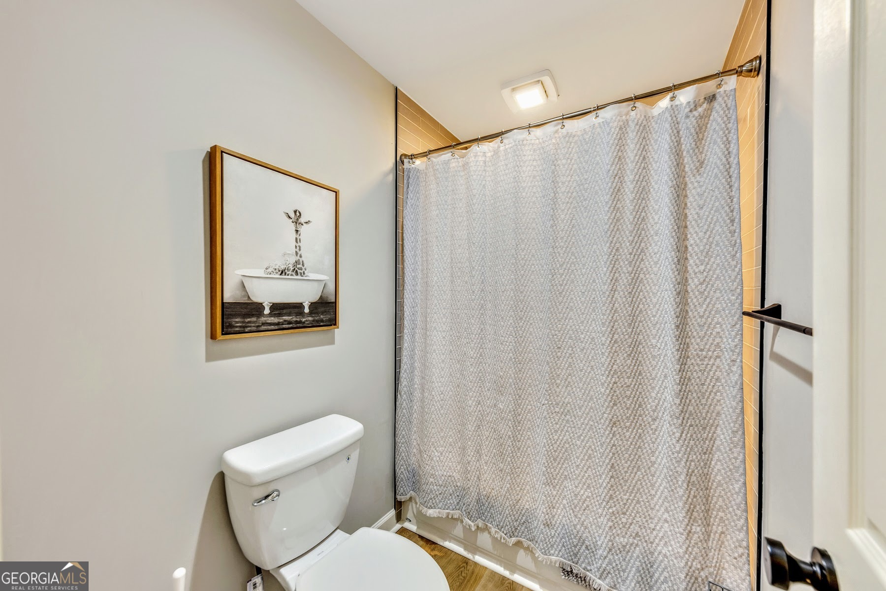 1018 Falling Valley Court Southeast Smyrna, GA 30080 - Photo 21 of 25 a white toilet sitting next to a small bathroom