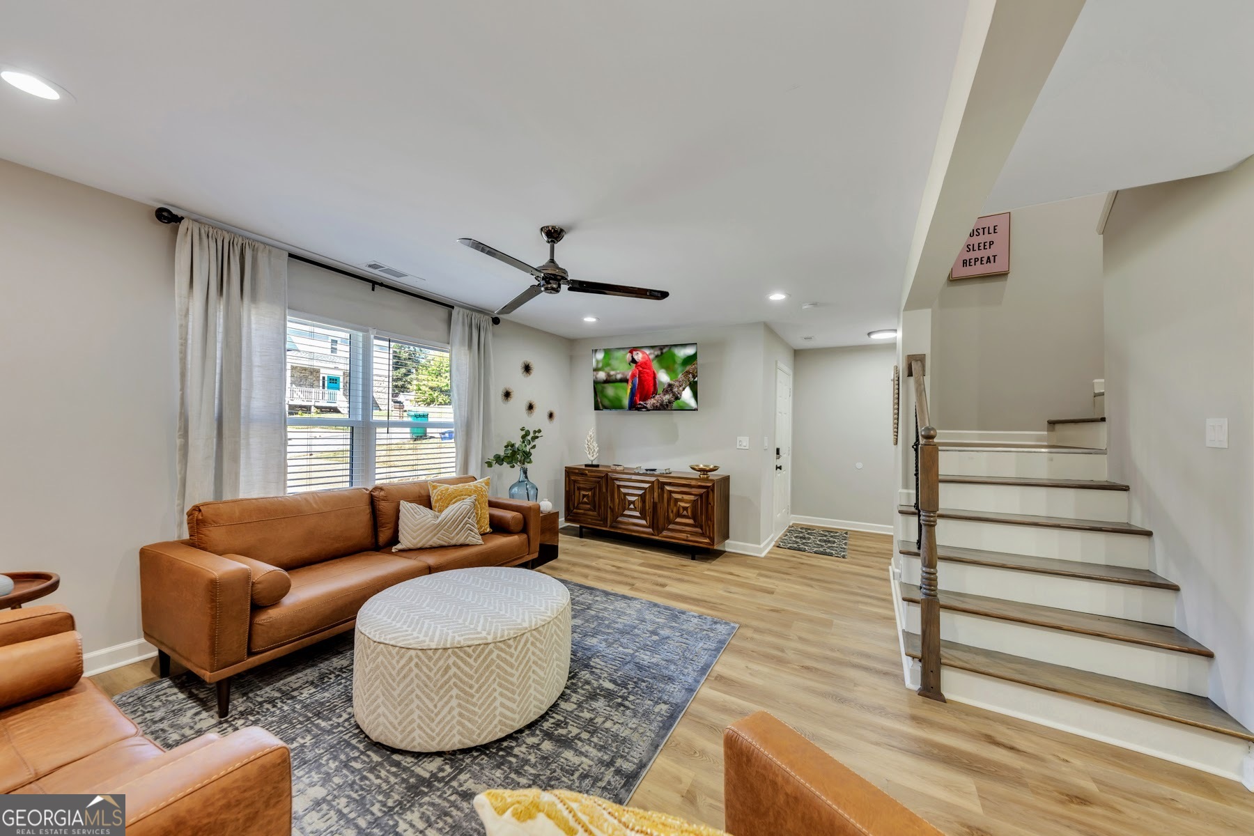 1018 Falling Valley Court Southeast Smyrna, GA 30080 - Photo 3 of 25 a living room with furniture and a large window