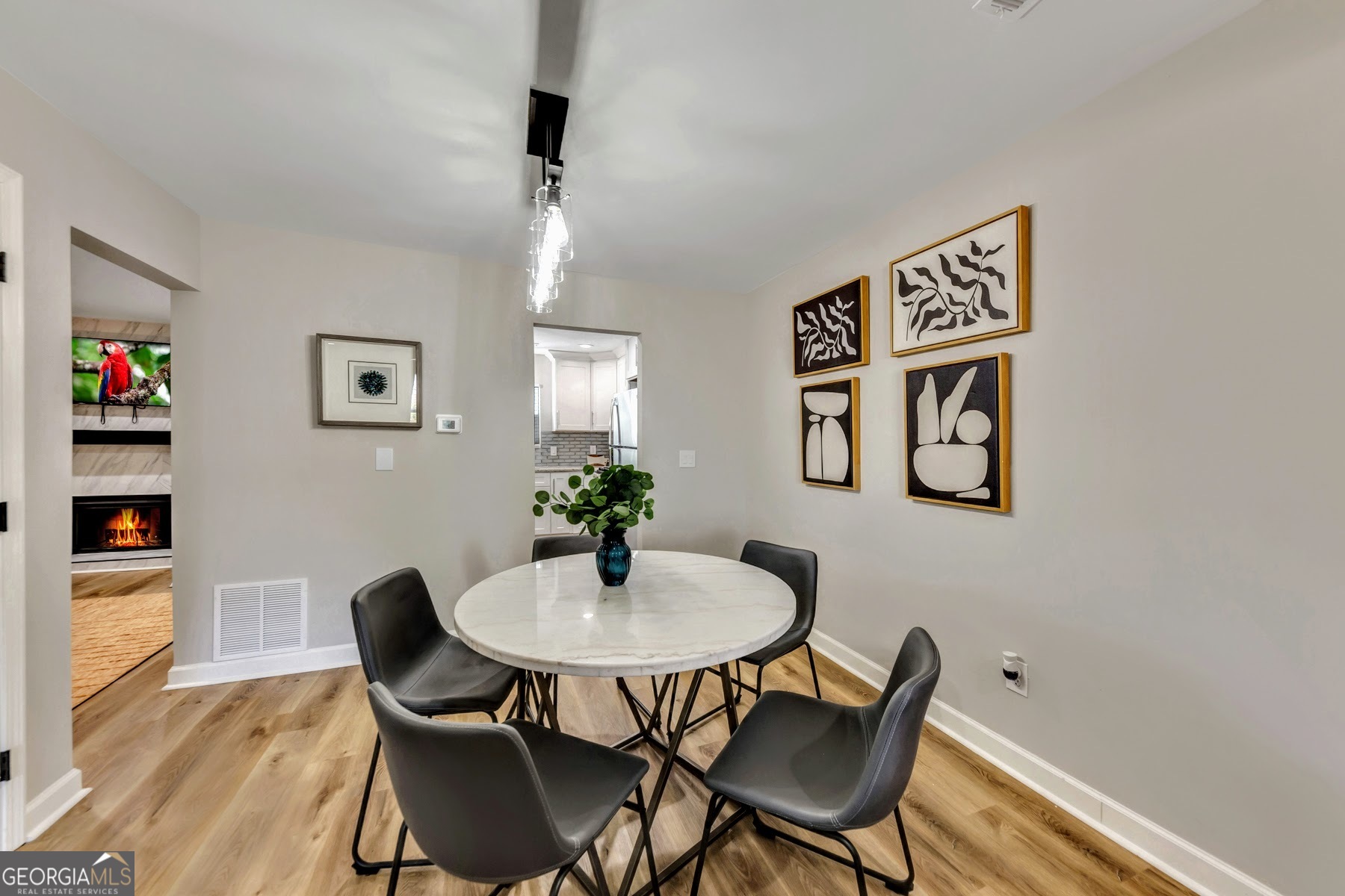 1018 Falling Valley Court Southeast Smyrna, GA 30080 - Photo 4 of 25 a view of a dining room with furniture and wooden floor