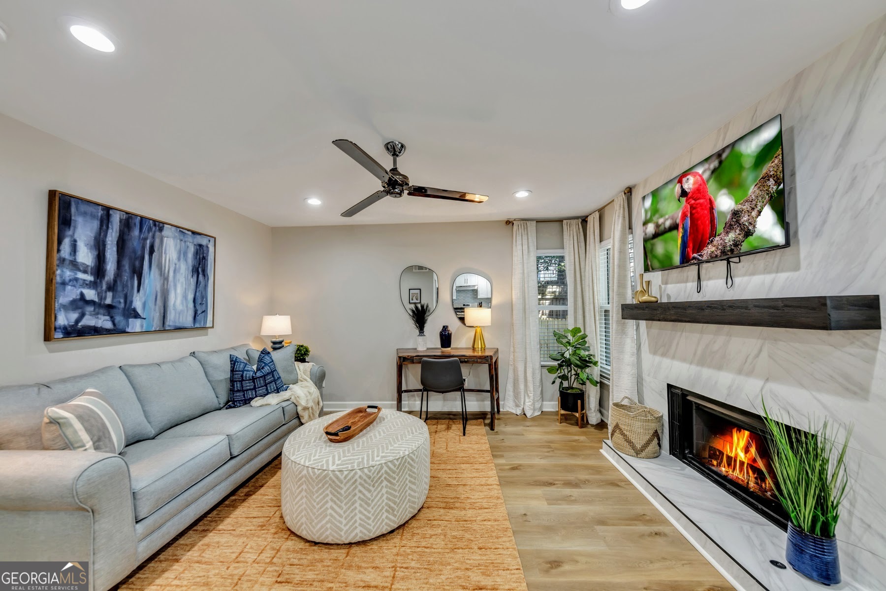 1018 Falling Valley Court Southeast Smyrna, GA 30080 - Photo 7 of 25 a living room with furniture and a fireplace