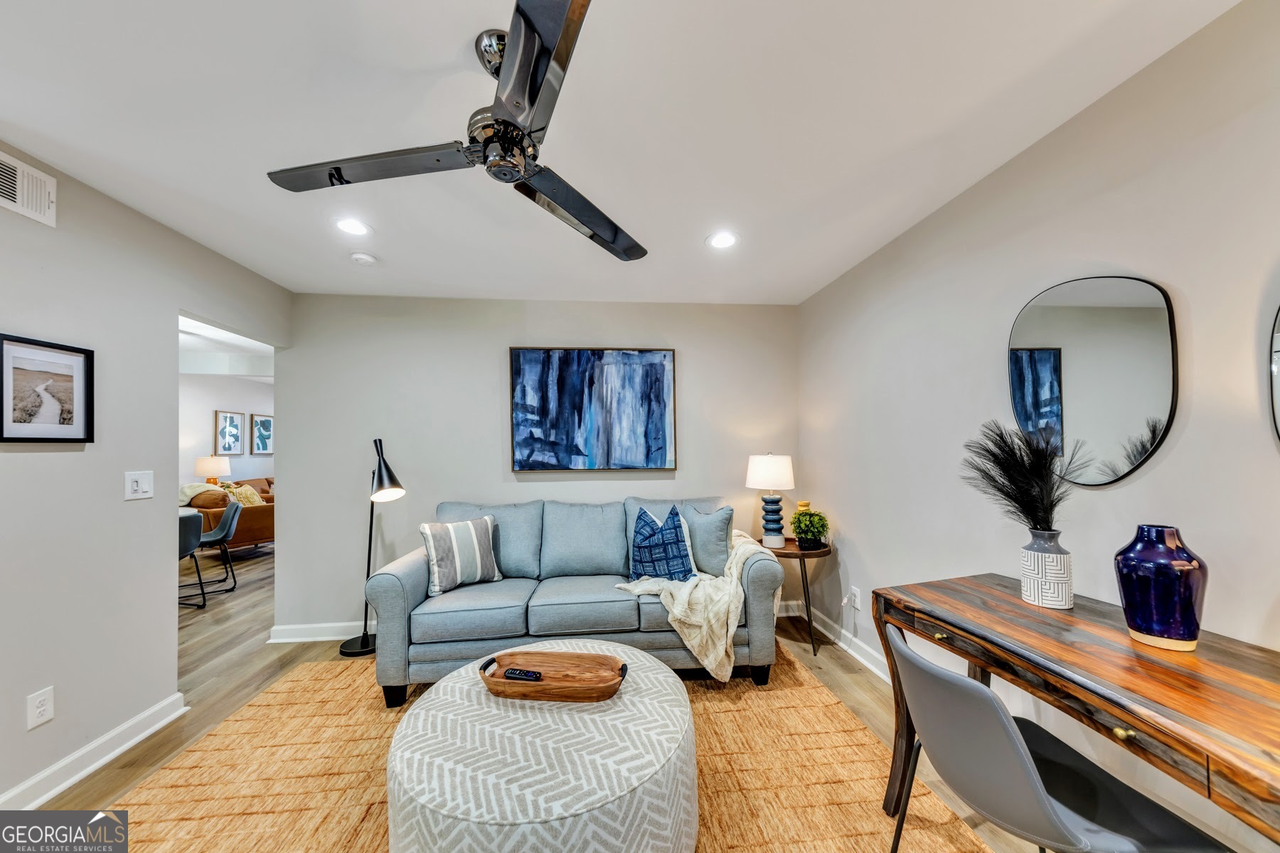 1018 Falling Valley Court Southeast Smyrna, GA 30080 - Photo 8 of 25 a living room with furniture and a wooden floor