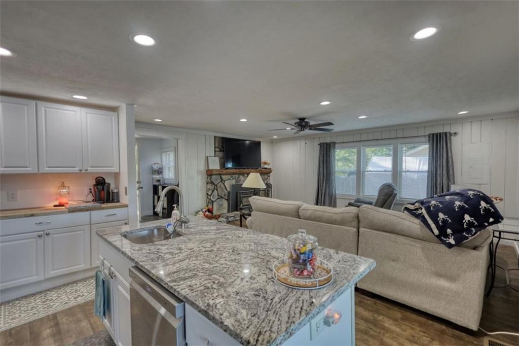 89 Miss Sarah Road Monticello, GA 31064 - Photo 29 of 77 a living room with granite countertop kitchen island stainless steel appliances furniture stove and kitchen island