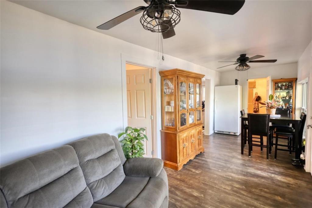 89 Miss Sarah Road Monticello, GA 31064 - Photo 32 of 77 a living room with furniture and a chandelier