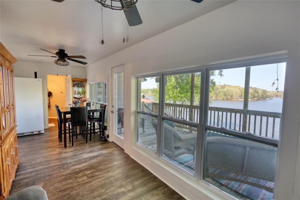 89 Miss Sarah Road Monticello, GA 31064 - Photo 34 of 77 a view of a dining room with furniture window and wooden floor