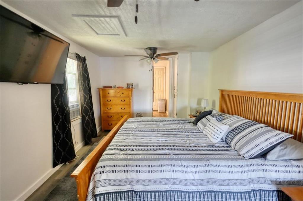 89 Miss Sarah Road Monticello, GA 31064 - Photo 36 of 77 a bedroom with a bed and a window