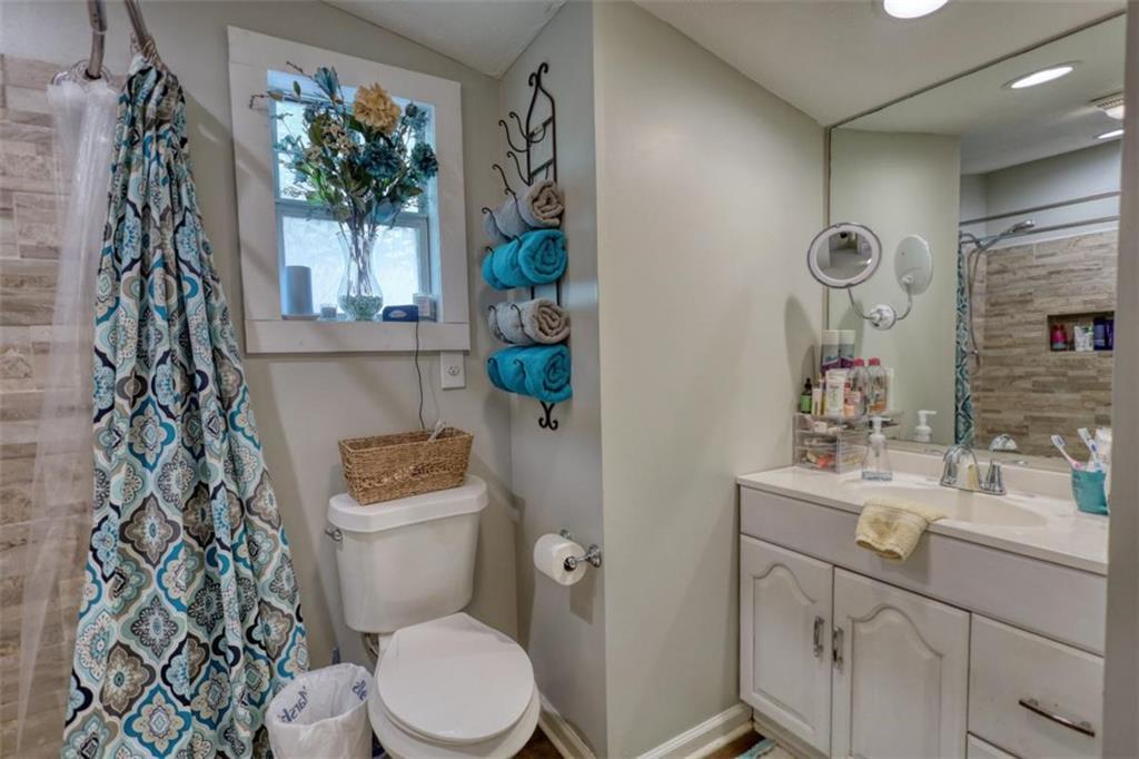 89 Miss Sarah Road Monticello, GA 31064 - Photo 39 of 77 a bathroom with a toilet sink and mirror
