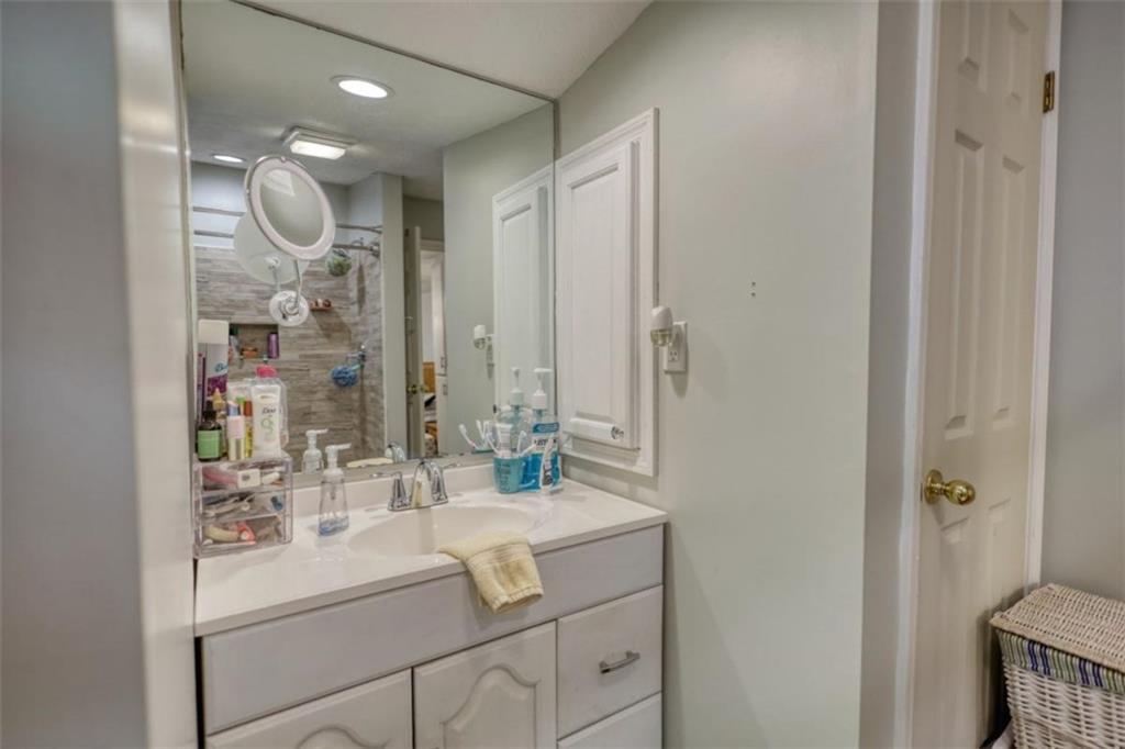 89 Miss Sarah Road Monticello, GA 31064 - Photo 41 of 77 a bathroom with a sink vanity and mirror