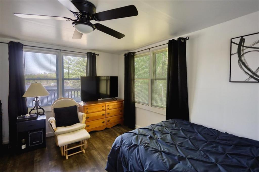 89 Miss Sarah Road Monticello, GA 31064 - Photo 43 of 77 a bedroom with a bed and a flat screen tv