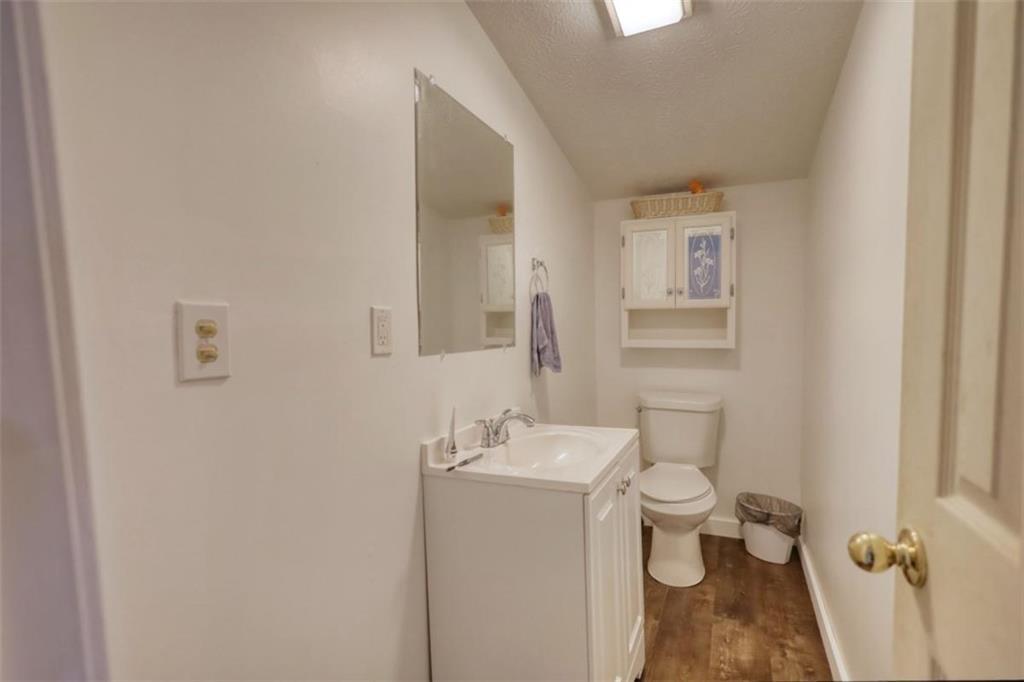 89 Miss Sarah Road Monticello, GA 31064 - Photo 50 of 77 a bathroom with a sink toilet and mirror