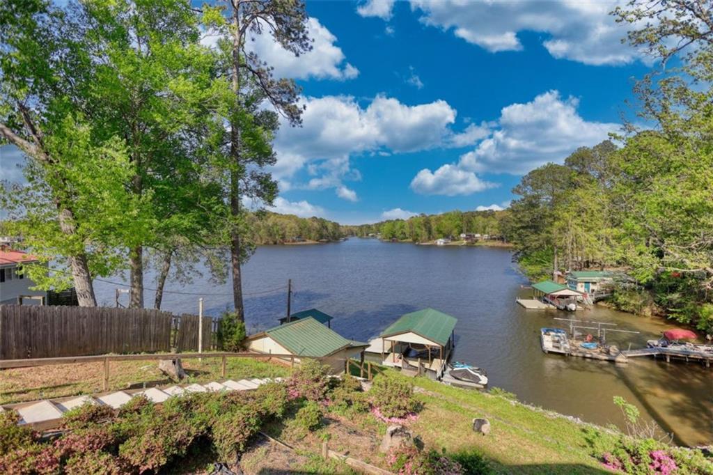 89 Miss Sarah Road Monticello, GA 31064 - Photo 56 of 77 a view of a backyard with table and chairs and potted plants