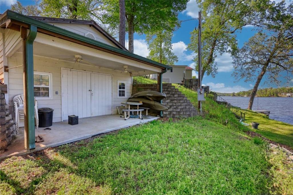 89 Miss Sarah Road Monticello, GA 31064 - Photo 61 of 77 a view of a chair and table in backyard of the house