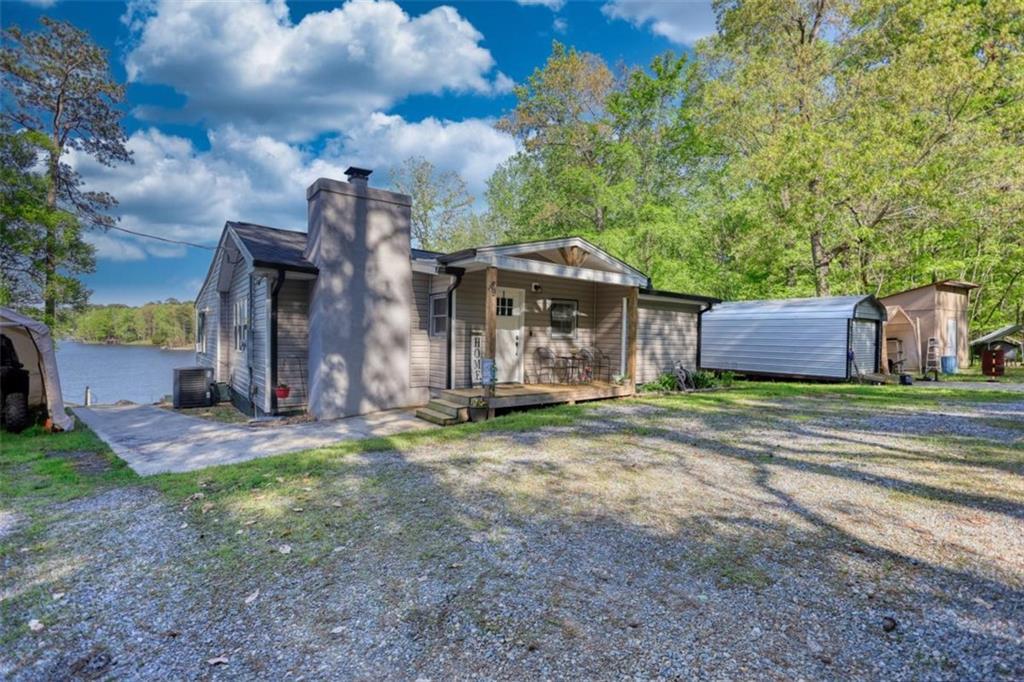 89 Miss Sarah Road Monticello, GA 31064 - Photo 67 of 77 a view of a house with a yard and large tree